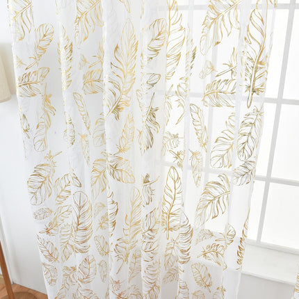 Valoverho elegantilla kultaisella höyhenkuviolla