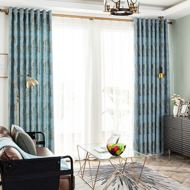 Verho tyylikkäällä kultaisella lehtikuviolla