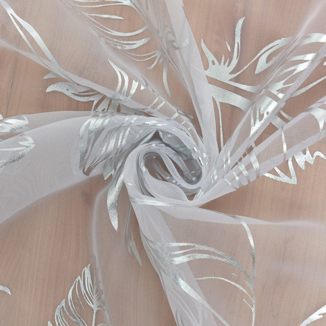 Valoverho elegantilla kultaisella höyhenkuviolla