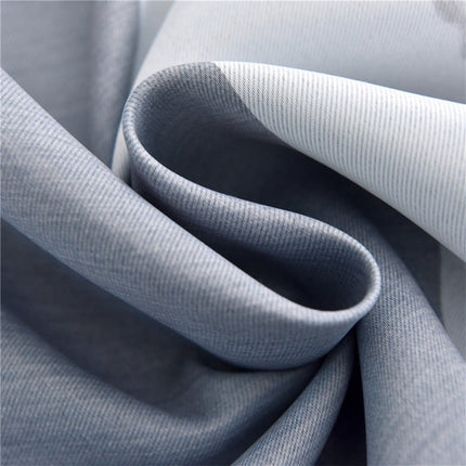 Harmaa pimennysverho näyttävällä maisemakuviolla