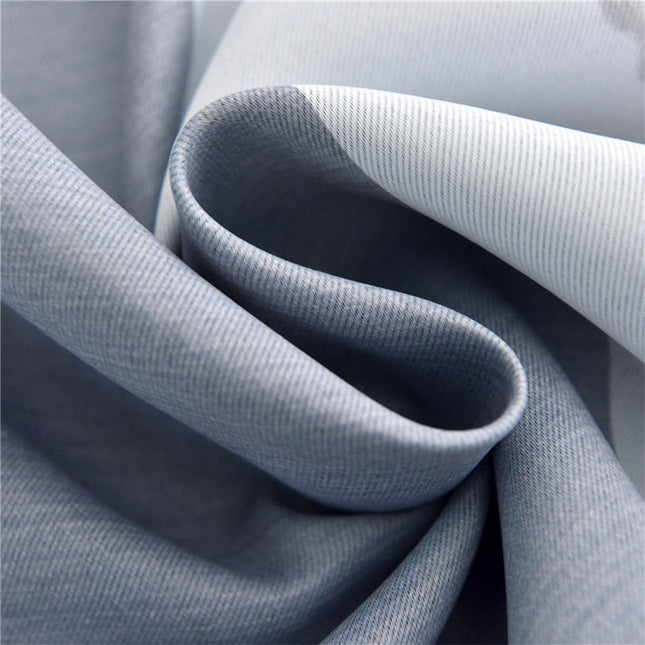 Harmaa pimennysverho näyttävällä maisemakuviolla