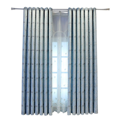 Kirjailtu valoverho herkällä kukkakuviolla