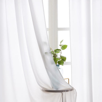 Yksivärinen vaalea läpikuultava valkoverho