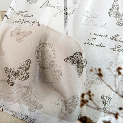 Valkoverho kauniilla perhoskuviolla