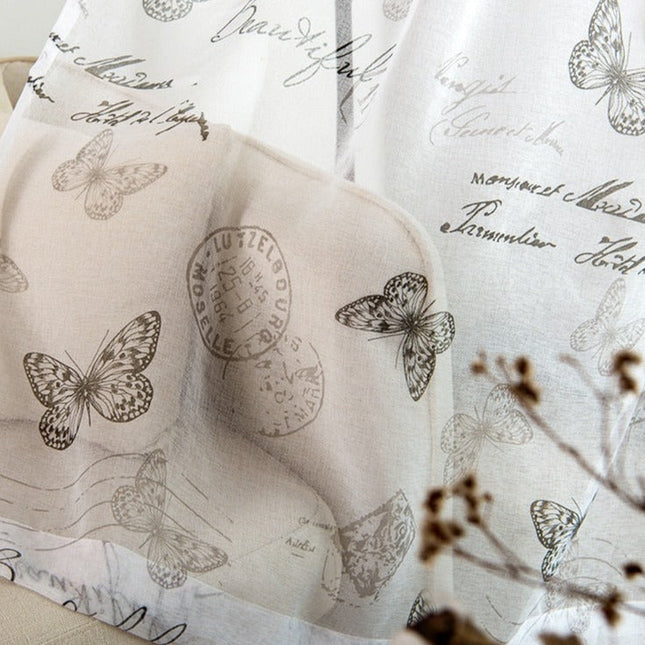 Valkoverho kauniilla perhoskuviolla