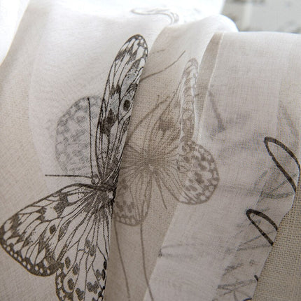 Valkoverho kauniilla perhoskuviolla