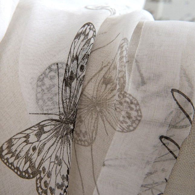 Valkoverho kauniilla perhoskuviolla