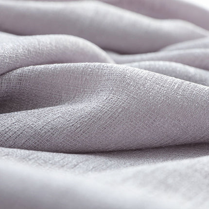 Strukturoitu valkoinen valoverho olohuoneeseen