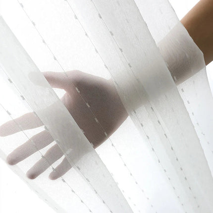 Valoverho kauniilla pilkkukuviolla