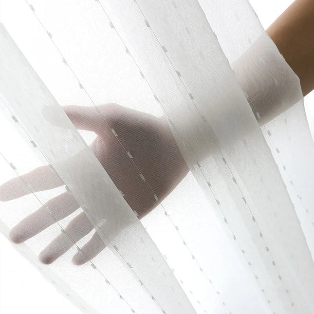 Valoverho kauniilla pilkkukuviolla