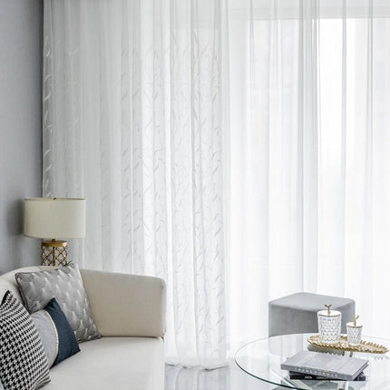 Valoverho kirjaillulla lehtikuviolla