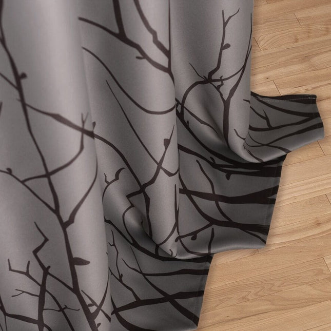 Luontoaiheinen verho oksakuviolla olohuoneeseen