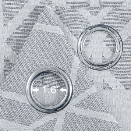 Vaaleanharmaa pimennysverho geometrisella kuviolla