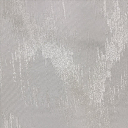 Teksturoitu harmaanruskea pimennysverho makuuhuoneeseen