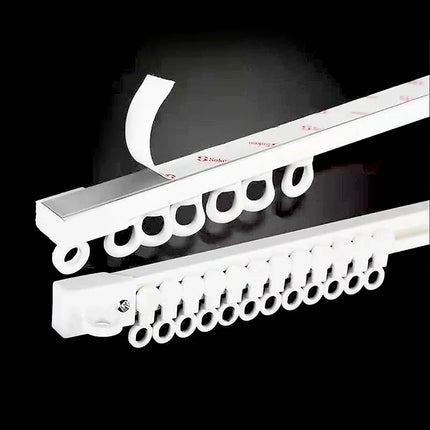 Itseliimautuva verhokisko ilman poraamista