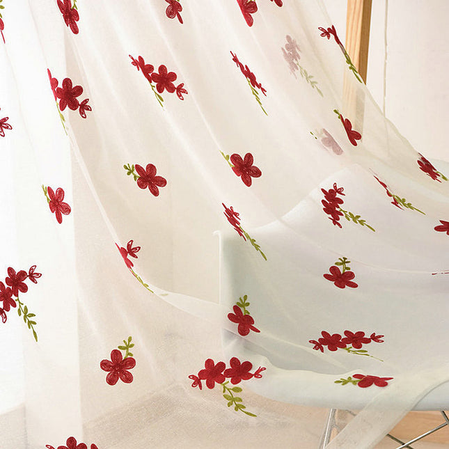 Valoverho brodeeratuilla punaisilla kukilla