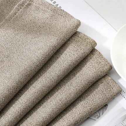 Yksivärinen tummanbeige verho olohuoneeseen