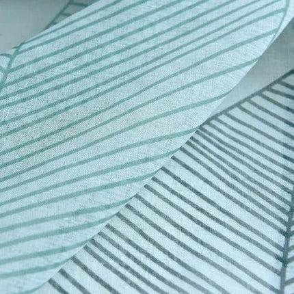 Valoverho tyylitellyllä lehtikuviolla