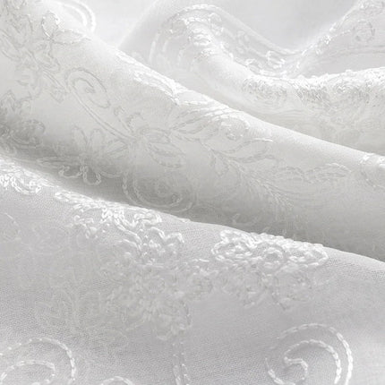 Klassinen valoverho beigellä damaskikuviolla