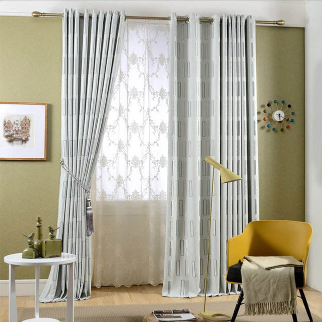 Harmaa pimennysverho graafisella kuviolla