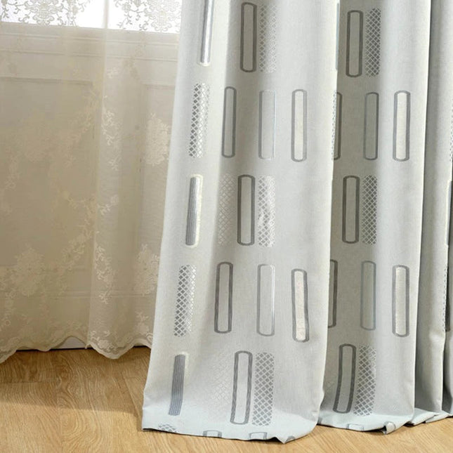 Harmaa pimennysverho graafisella kuviolla