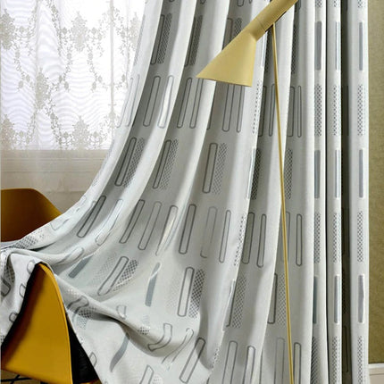 Harmaa pimennysverho graafisella kuviolla