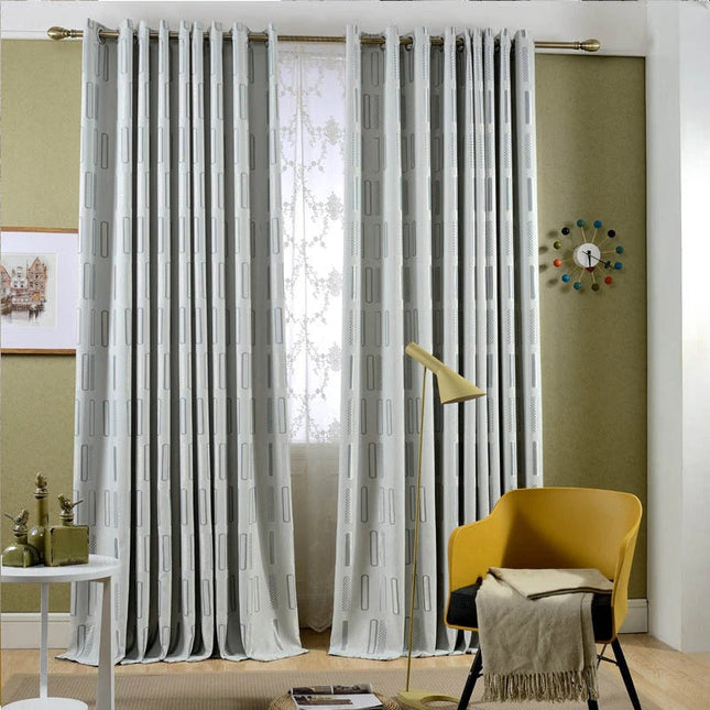 Harmaa pimennysverho graafisella kuviolla